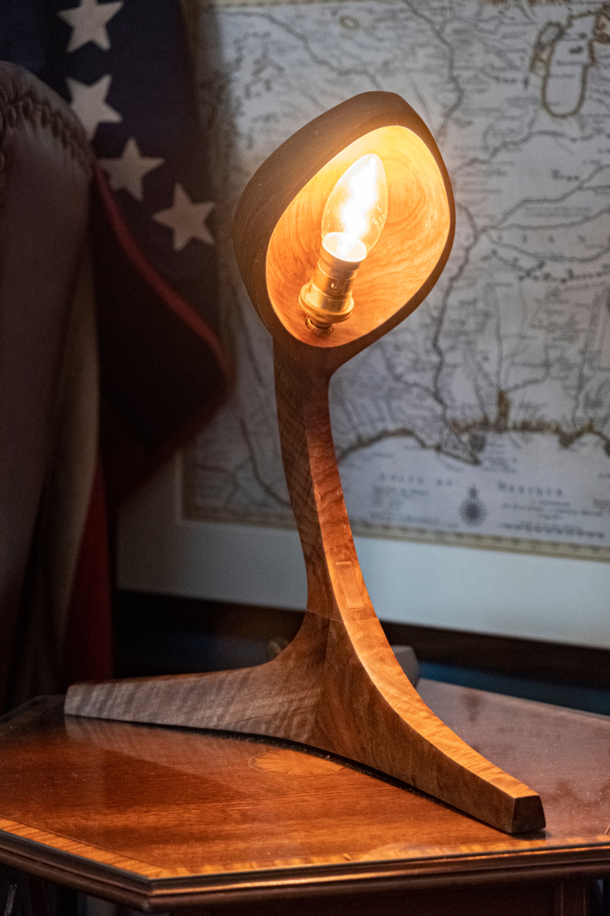 Discover the Live Edge Cobra Lamp, an extraordinary and stylish wooden table lamp that adds a touch of distinctive charm to your living space. Meticulously handcrafted from exquisite Black Walnut Wood, each lamp is a masterpiece of intricate artistry, boasting captivating details that effortlessly elevate your home decor. The gracefully curved wood carvings infuse a sense of originality into any interior, while the lamp's poised neck exudes the elegance of a cobra.