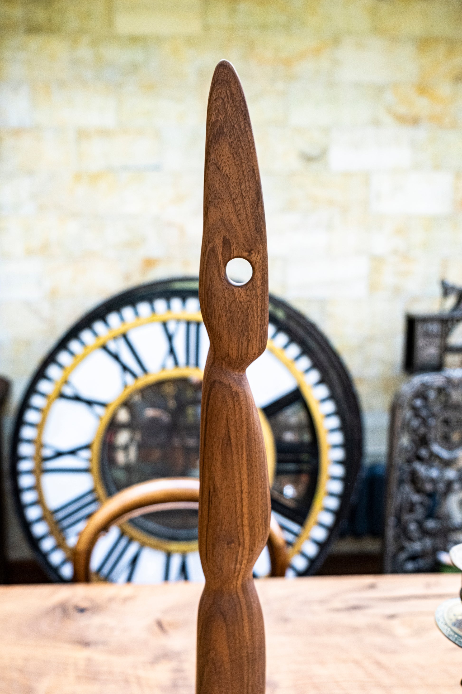 Introducing 'The Visitor' - a Remarkable Live Edge Sculpture. This captivating figurine is meticulously crafted from high-quality Black Walnut wood, showcasing exceptional grain patterns and a delicate aesthetic that's bound to mesmerise all who encounter it. This natural and organic sculpture reaches a height of 85cm and rests upon a 15cm square base, making it a truly unique and original wood sculpture.