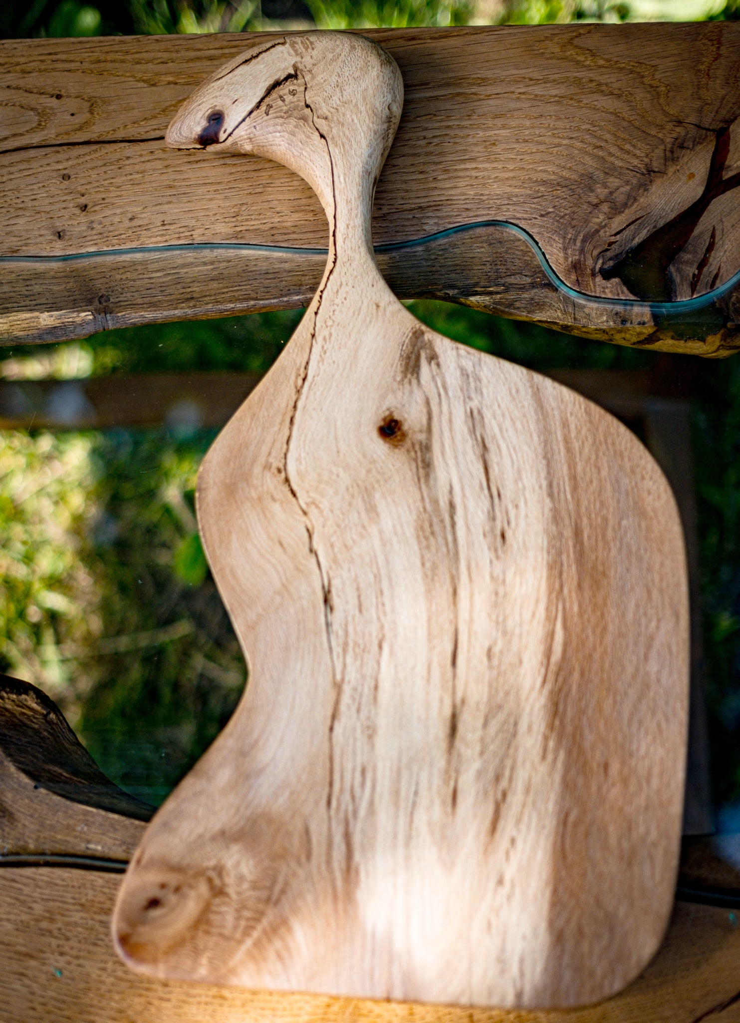 L'Oiseau, our one-of-a-kind deli tray that combines functionality and artistry. Crafted from the finest wood with a Live Edge finish, L'Oiseau is a stunning wood sculpture. With its unique design and bird-like head, L'Oiseau adds a touch of whimsy to your dining experience. Whether you're hosting a party, enjoying a casual lunch, or searching for a statement piece for your kitchen, this rustic deli tray will impress your guests.