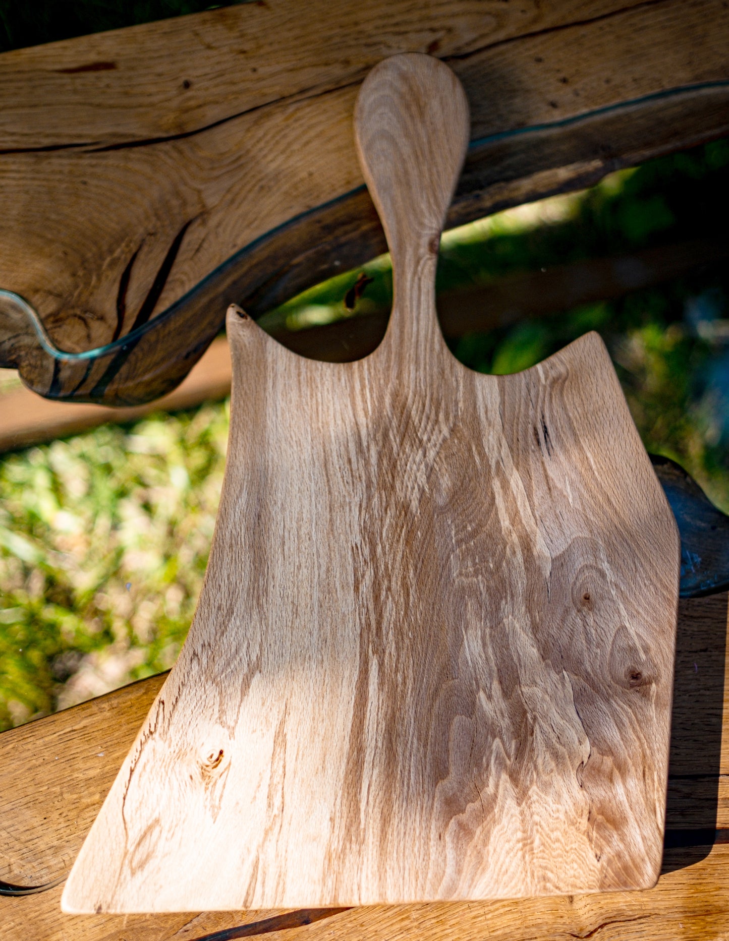 Introducing "The Guest" by Live Edge Creations, a remarkable wood sculpture and functional deli tray crafted from spalted beech wood. This unique piece features Live Edges and graceful curves, reminiscent of a gracious persona. It's the perfect addition to elevate your culinary presentation and leave a lasting impression on your guests. Handcrafted with meticulous care and attention to detail, "The Guest" is a true testament to the beauty of kitchen accessories and bespoke carpentry.