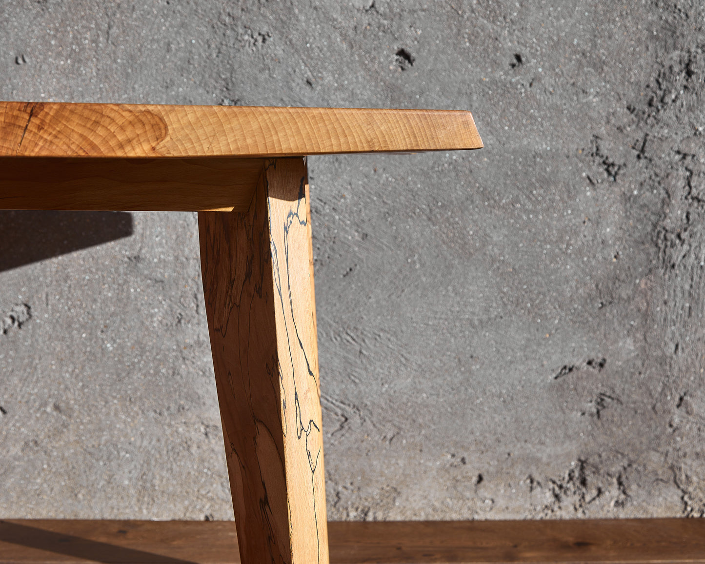 The captivating Moff Dining Table embodies the essence of Live Edge functional art. Crafted from spalted beech, this natural edge table boasts an exquisitely detailed pattern that sets it apart. The infusion of mid-century modern legs with the masterfully book-matched tabletop imparts abundant character to this solid wood dining table. Its finish, adorned with natural wax, imparts a delightful, luminous sheen. Anticipate this table becoming the centerpiece of any room, providing years of enjoyment.