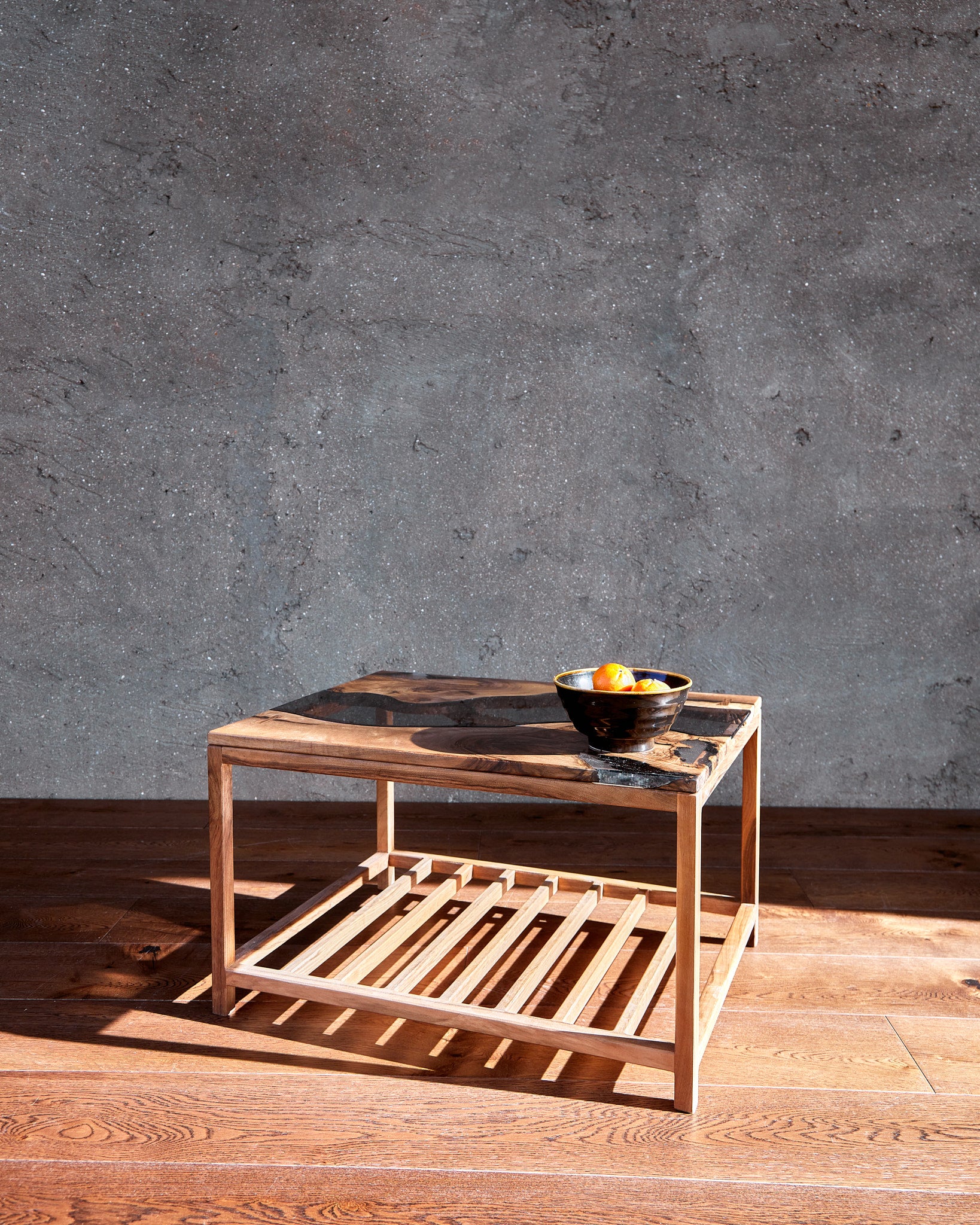 Explore The Narva River Table by Live Edge Tables, an exquisite Live Edge river table meticulously handcrafted from Black Walnut wood, known for its exceptional strength and durability. This table epitomizes top-quality woodwork, with a contemporary design featuring a natural raw edge that effortlessly enhances any home. The striking beauty of the wood, coupled with expert craftsmanship, is certain to leave a lasting impression.