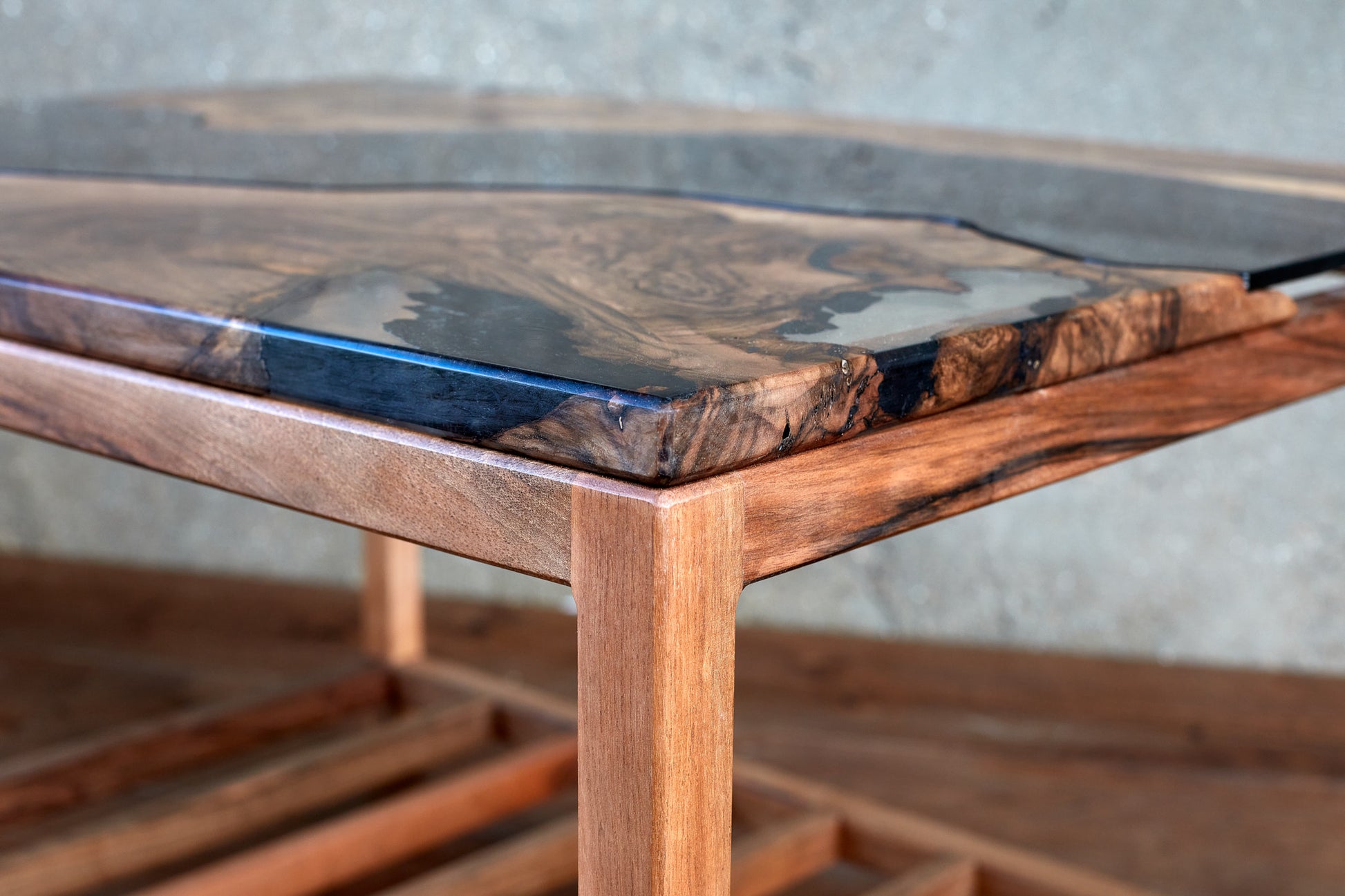 Discover The Narva River Table, a magnificent Live Edge river table meticulously handcrafted from Black Walnut wood by Live Edge Tables. This wood is renowned for its exceptional strength and durability, ensuring that this table is of the highest quality. With a contemporary design featuring a natural raw edge, it seamlessly fits into any home. The wood's stunning beauty and the impeccable craftsmanship are certain to leave an indelible impression.