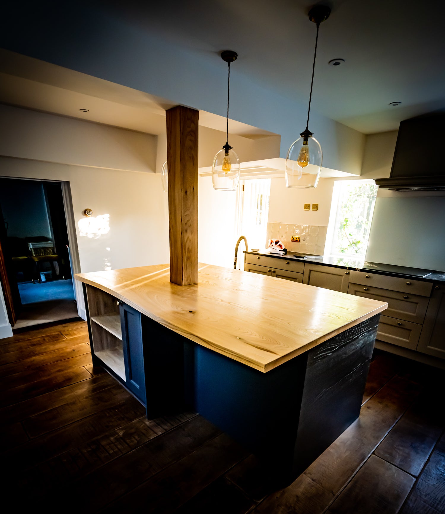 Live Edge Creations presents a natural Sweet Chestnut wood kitchen island with raw live edges, adding rustic charm and organic beauty to the culinary space. Made with high quality wood, a sleek contemporary light beige coloured wood creates a countertop centrepiece that looks amazing and inviting.