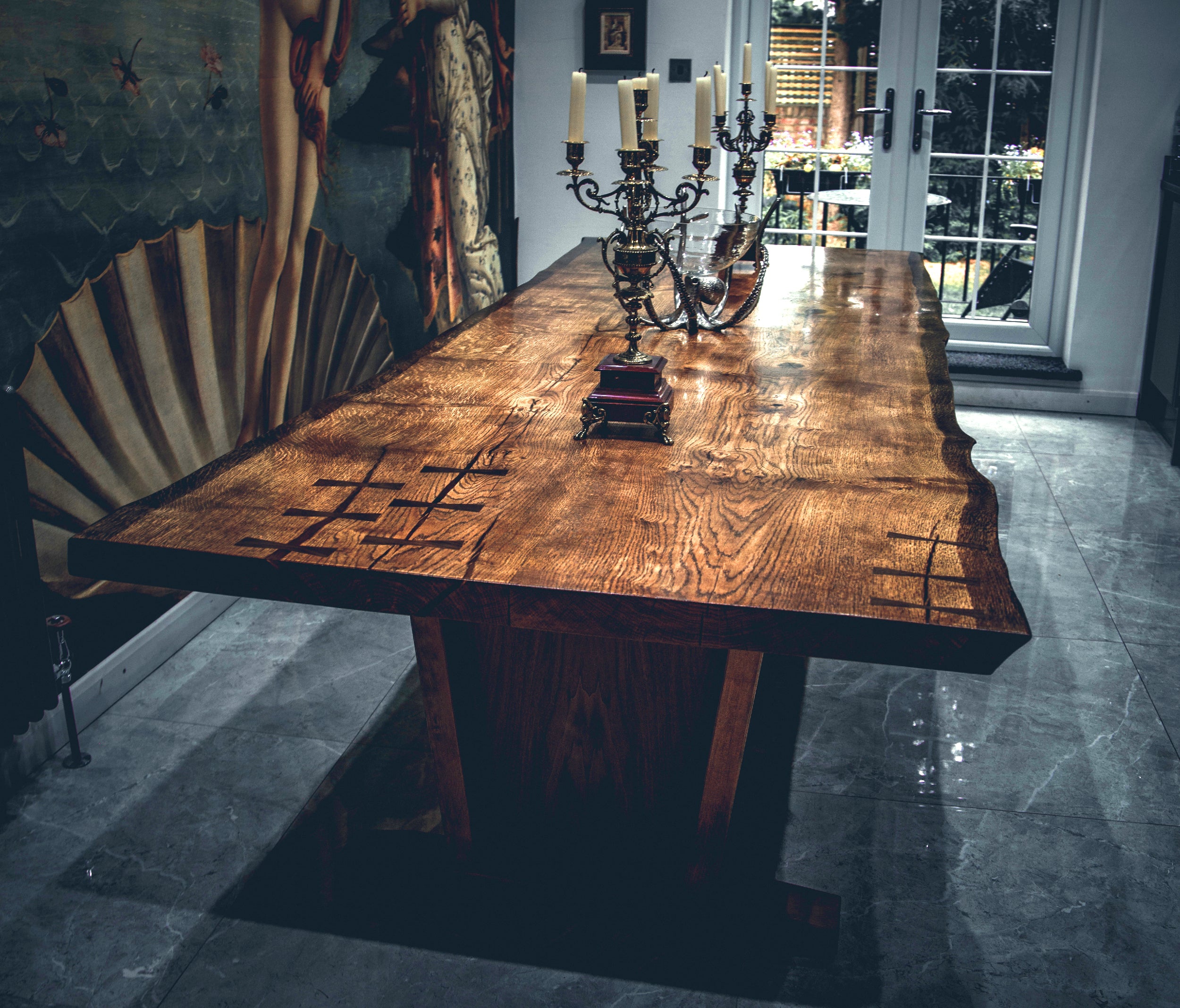 Elevate your kitchen into a haven with this expansive live edge table, featuring a one-of-a-kind wood slab that adds a touch of timeless elegance. Immerse yourself in the grandeur of Live Edge Creations with this remarkable dining table, meticulously crafted from the finest high-quality black walnut wood. This striking handmade masterpiece showcases live edge accents, drawing attention to its uniquely exquisite grain patterns, while embracing an authentic and organic aesthetic.