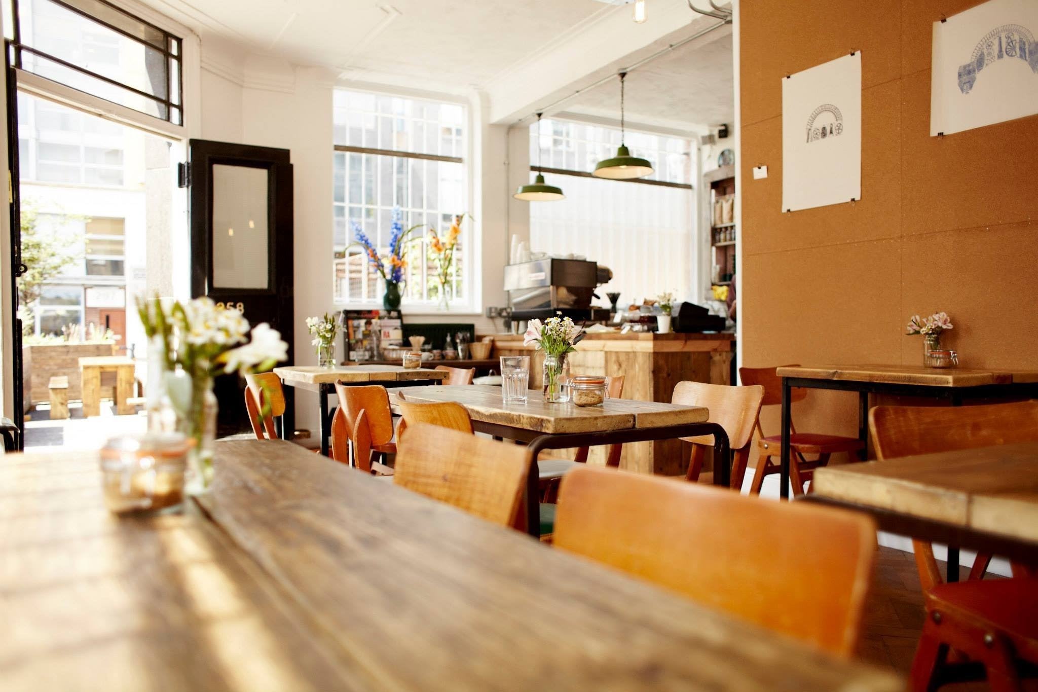 Step into the Dining Ambiance: Live Edge Installations by Live Edge Creations. Introducing Interior and Exterior Design Expertise at Curio Cabal Coffee Shop, featuring High-Quality Pine. Immerse Yourself in Distinctive Wooden Decor, Masterfully Handcrafted Custom Creations, all Responsibly Sourced, Embracing an Authentic Organic Rustic Charm.