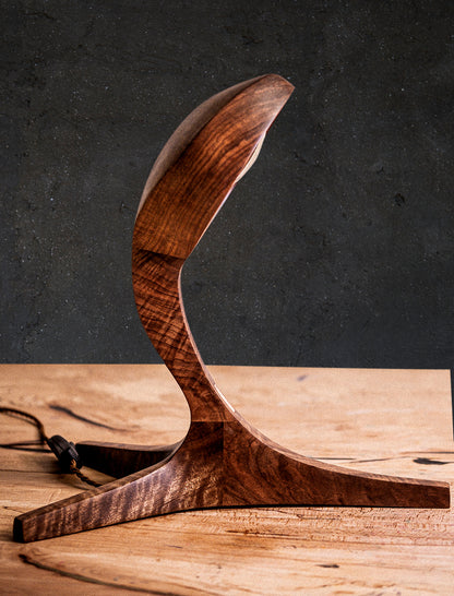 Discover the Live Edge Cobra Lamp. Meticulously handcrafted from remarkable Black Walnut Wood, each lamp is an intricate work of art, boasting striking details that make it a perfect addition to your home decor. The lamp's gracefully curved wood carvings introduce a sense of originality to any interior, while its poised neck resembles a cobra, adding a touch of exotic elegance. Elevate your space with this one-of-a-kind, high-quality wood designer lamp, skillfully crafted by our talented artisans.