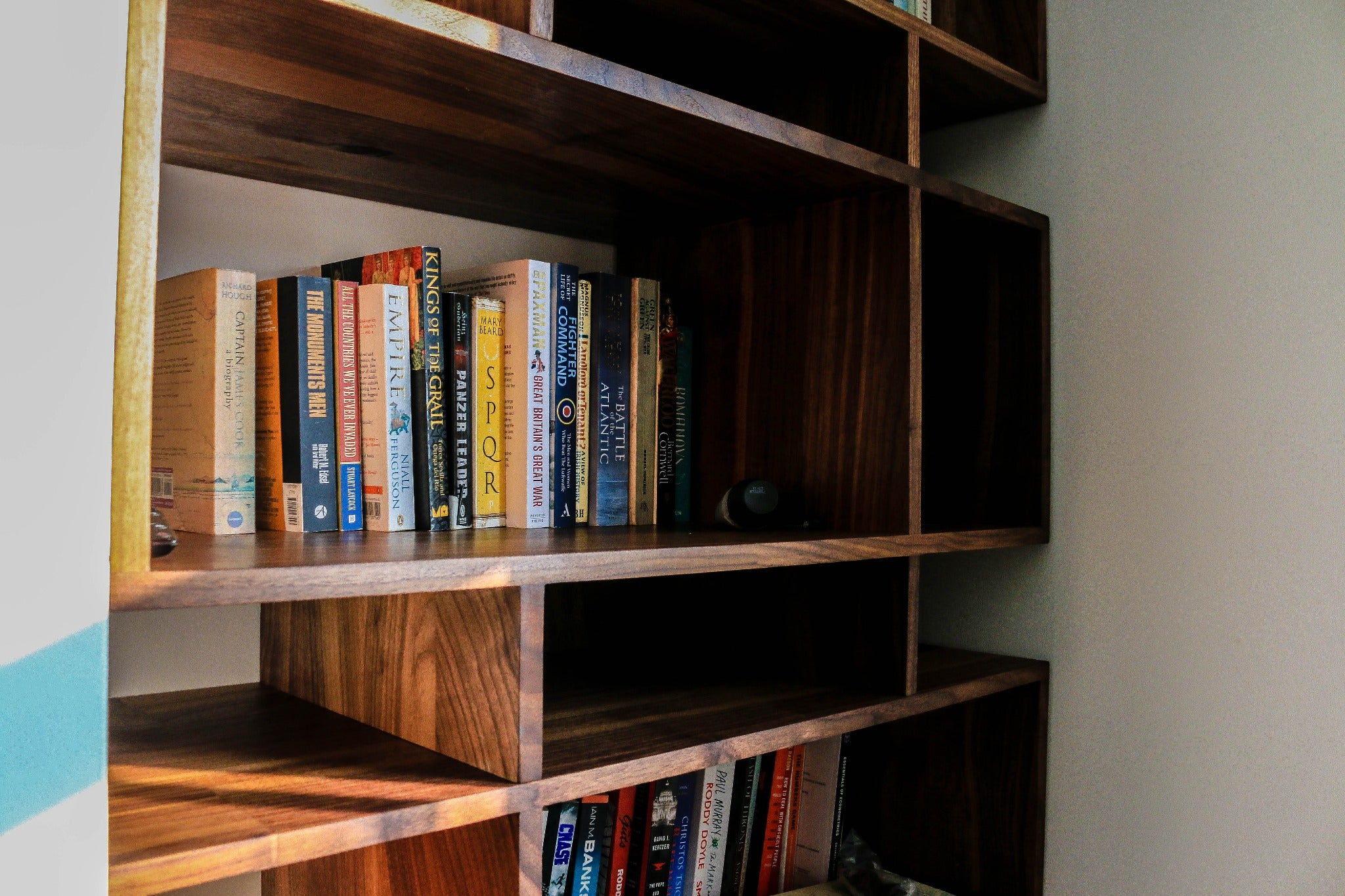 Live Edge Creations meticulously craft a black walnut wood bookcase. Live Edge Shelving, designed to perfectly match your preferences and requirements. Elevate the visual appeal of your living space by embracing the inherent sophistication of nature's finest materials.